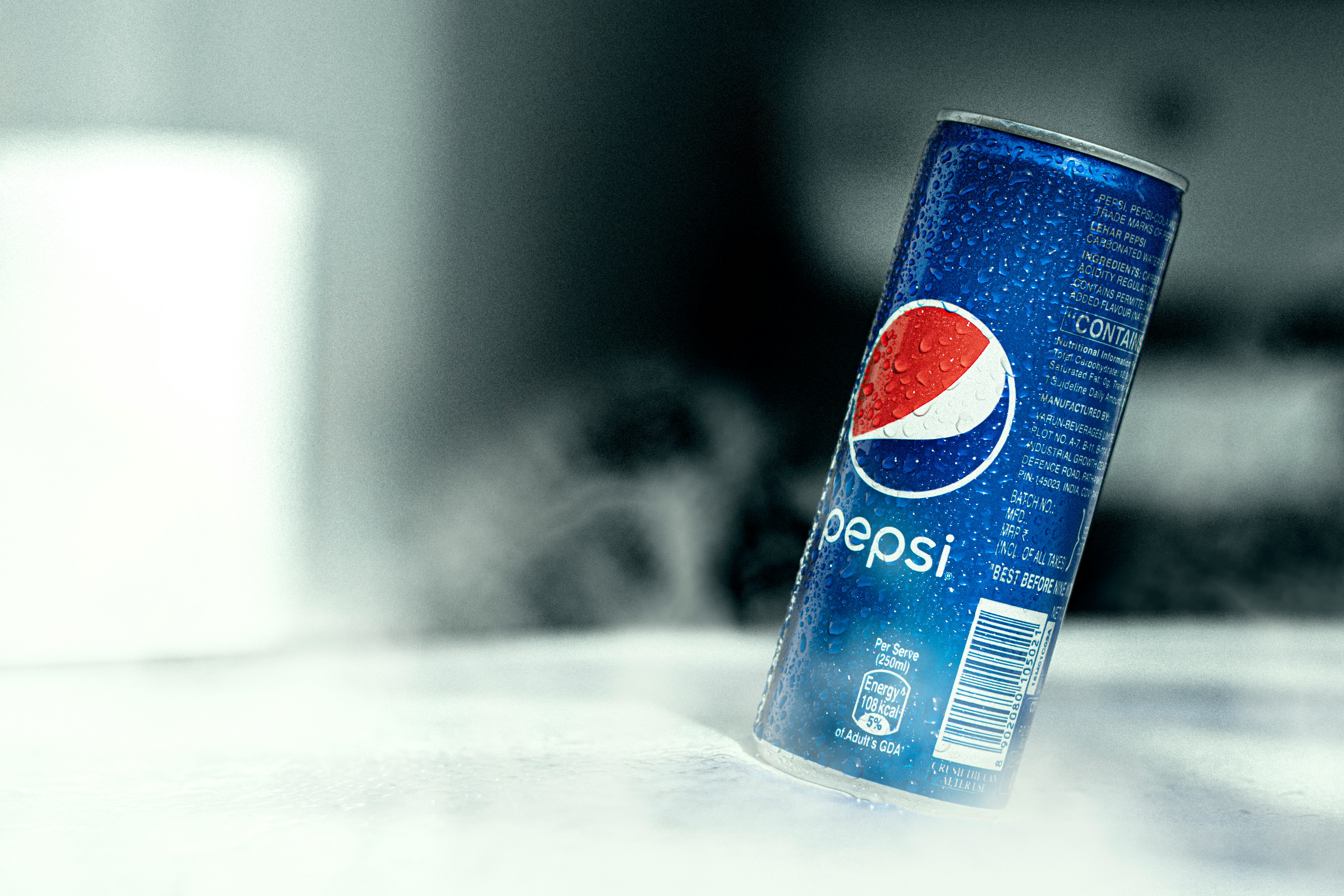 A Pepsi can tilting tot he right
