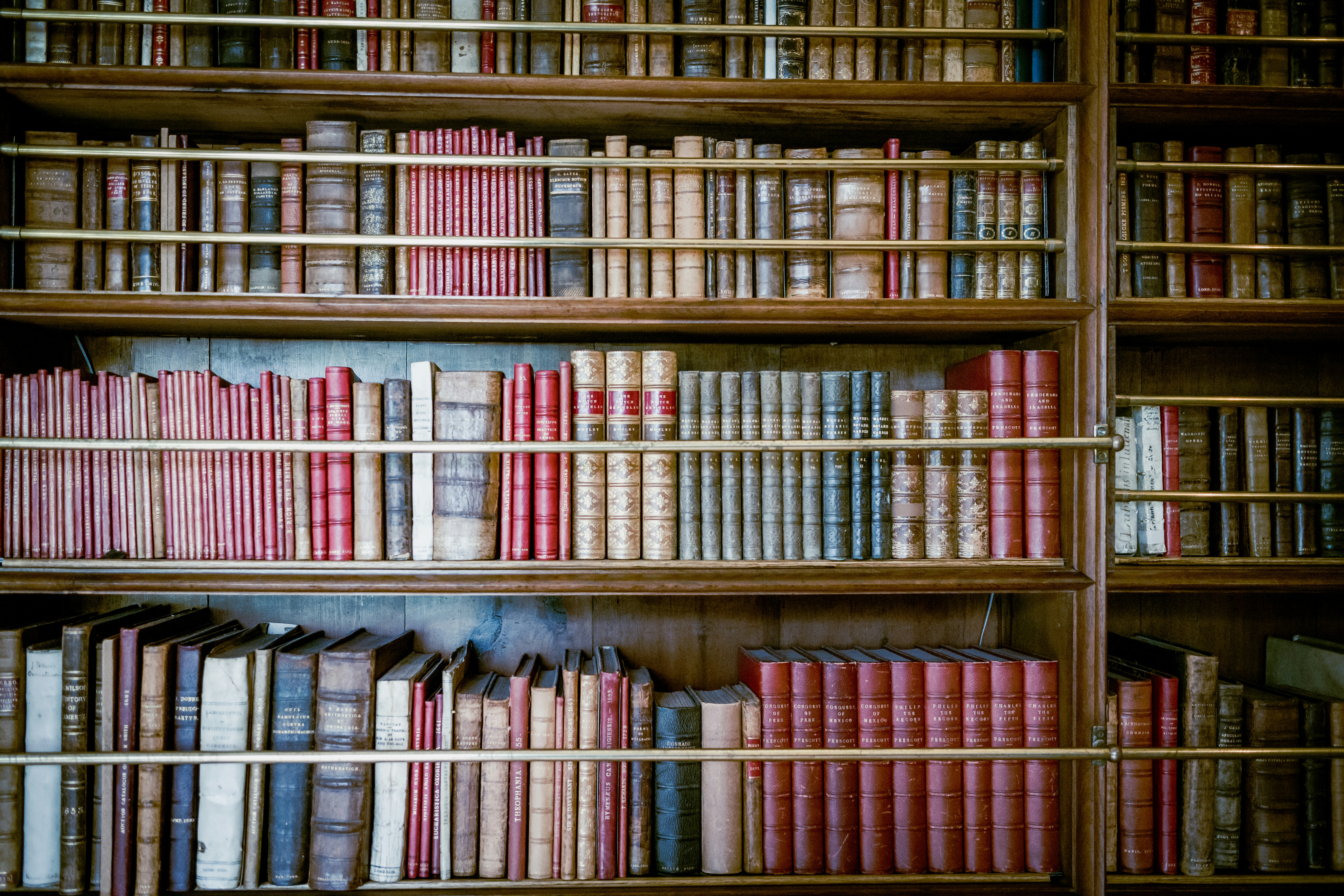 Image of a library with classic bound books; Cracking the books for a 2024 market review